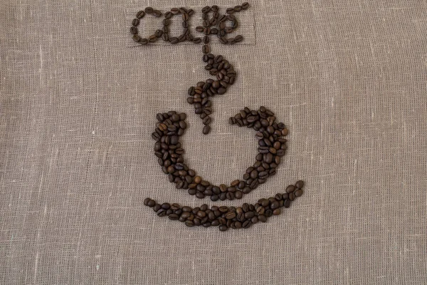 Grains de café torréfiés, lin, le mot café en français, café, carte, tasse de café, en espagnol , — Photo