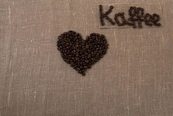 Roasted coffee beans, flax, coffee word in the German language, coffee, greeting, German, heart,