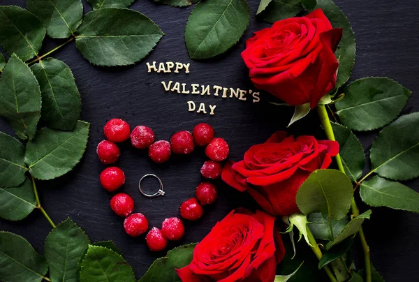 Happy Valentine inscription, cherries in a heart with red roses, rings, close-up — Stock Photo, Image