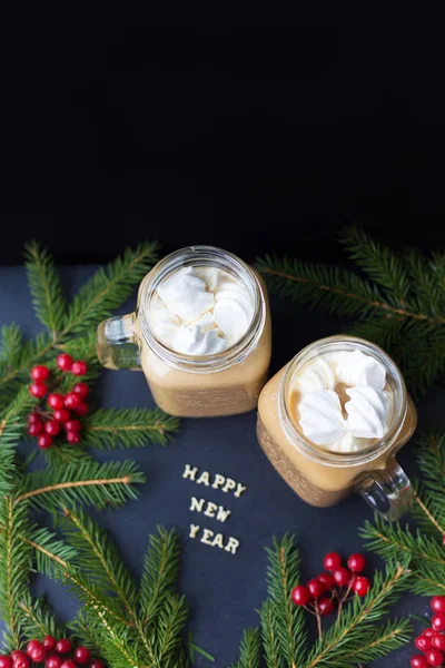 Christmas holiday background with hot cocoa marshmellou. The inscription Happy New Year. Close-up