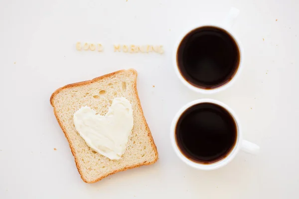 Sandwich for breakfast in the form of heart with cheese - good morning sign and two coffee cups — Stock Photo, Image