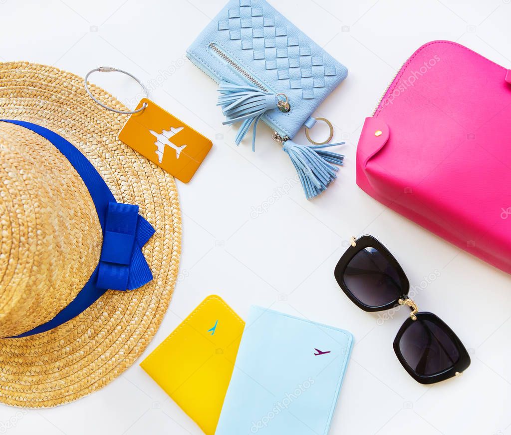 Preparation for vacation - hat, glasses, passport, cosmetic bag, purse. Close-up