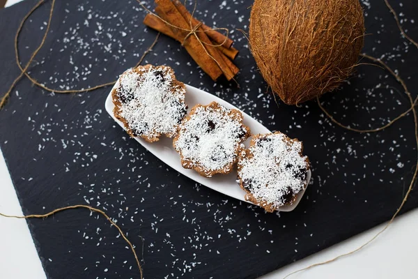 stock image coconut muffins on a black background