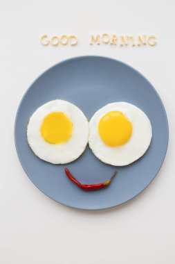 two beautiful eggs on a plate clipart
