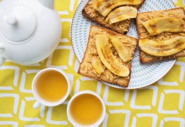 Toast with peanut butter and fried banana, delicious breakfast