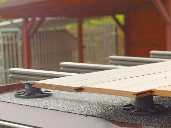 Terrace under decking boards