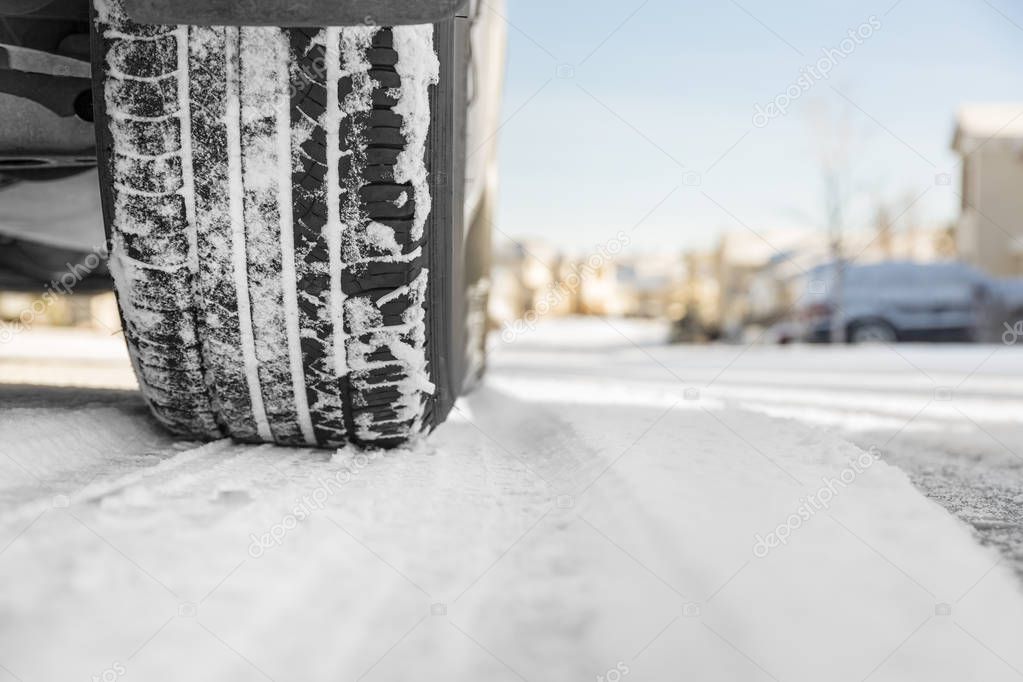 Car tire on snow