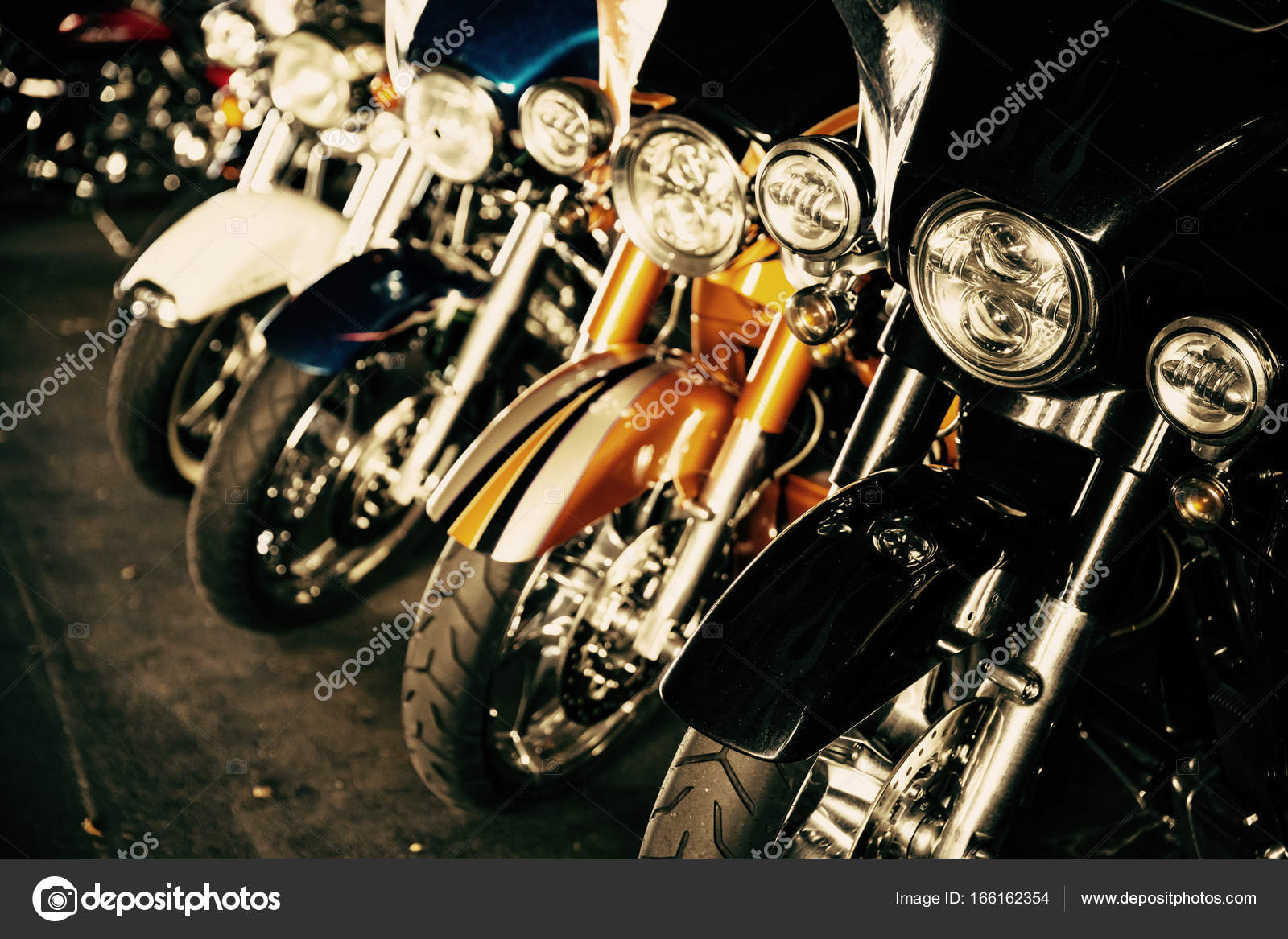 Motorcycles parked in a row Stock Photo by ©mblach 166162354