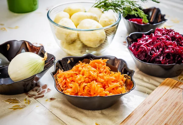 Preparing russian traditional salad herring under fur coat — Stock Photo, Image