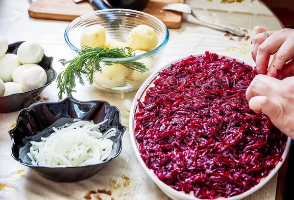 Preparing russian traditional salad herring under fur coat — Stock Photo, Image