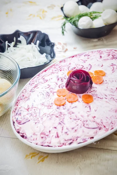 Preparing russian traditional salad herring under fur coat — Stock Photo, Image