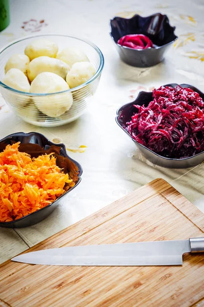 Preparing russian traditional salad herring under fur coat — Stock Photo, Image