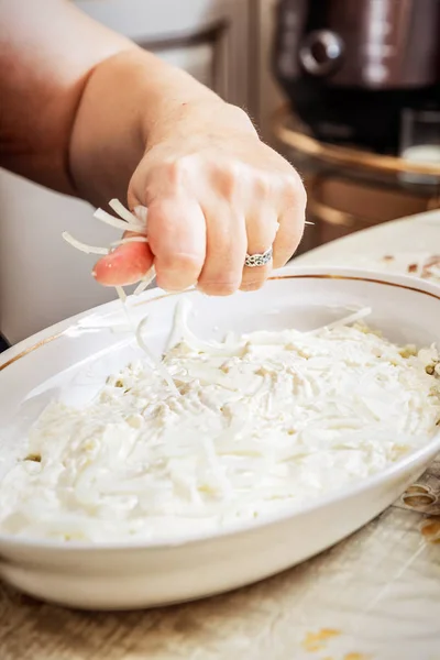 Preparing russian traditional salad herring under fur coat — Stock Photo, Image