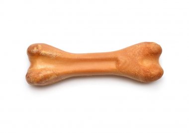 Beyaz arka plan üzerinde izole çiğneme için köpek kemiği