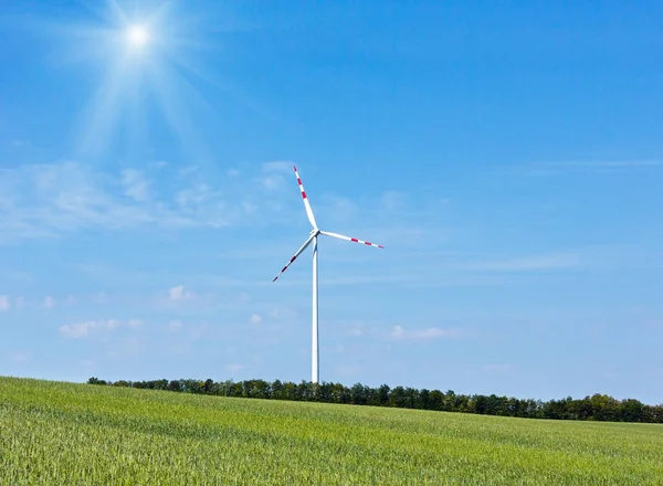 Wind turbine on blue sky background — Stock Photo, Image