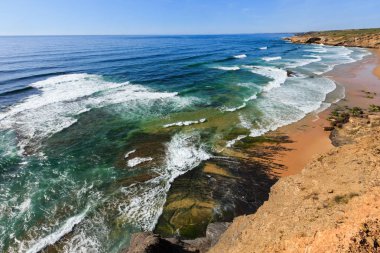 Summer Atlantic ocean coast. Algarve, Portugal.  clipart