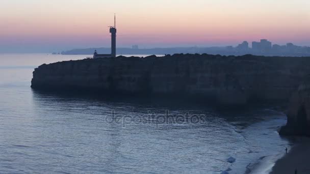 Sea coast sunset landscape and lighthouse. — Stock Video