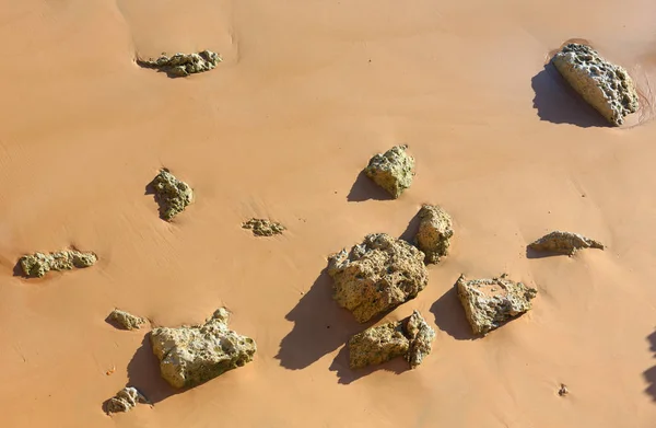 Rock debris on sand. — Stock Photo, Image