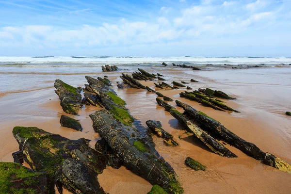 Rock formations on sandy beach (Portugal). — Stock Photo, Image