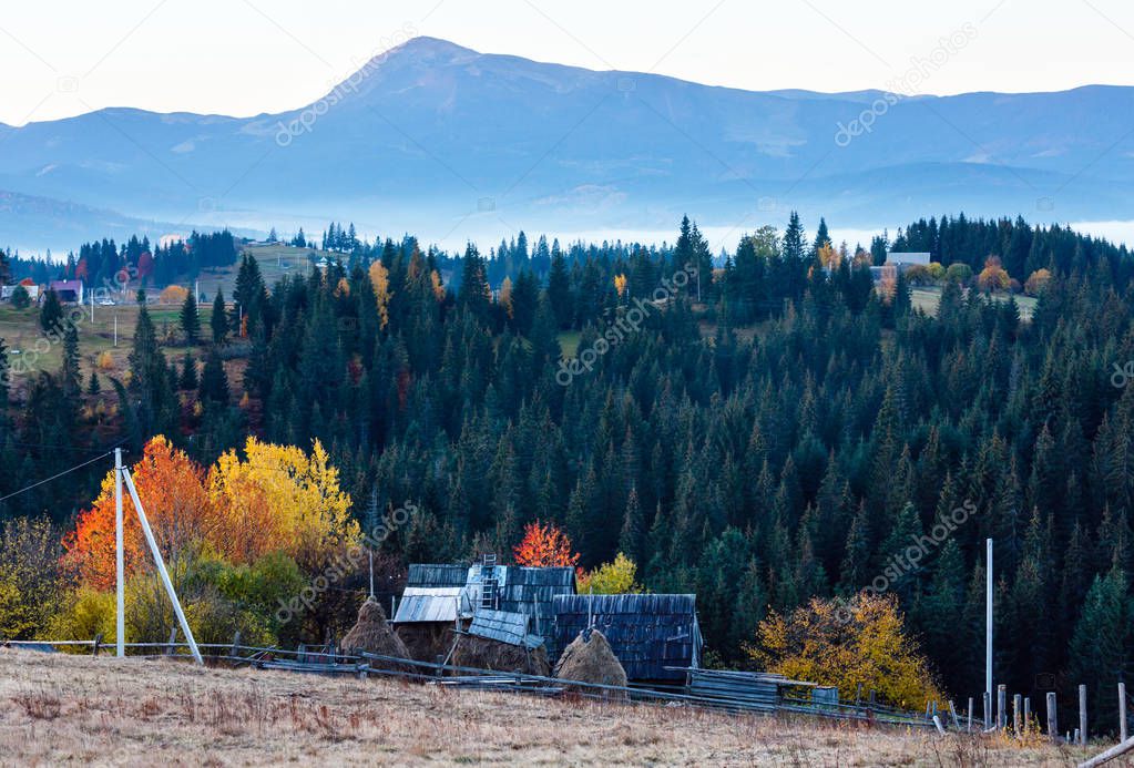 Early morning misty autumn Carpathian mountain village, Ukraine.