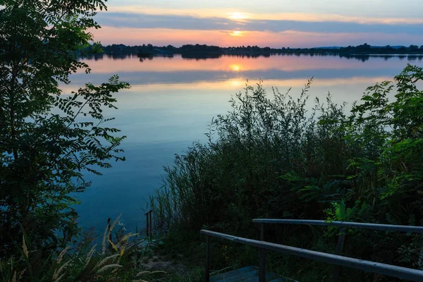 Wooden stairs to summer sunset lake — Stock Photo, Image