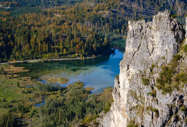 View from up to autumn Alps mountain lake with clear transparent — Stock Photo, Image