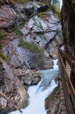 Mountain alpine autumn Wimbachklamm gorge and Wimbach stream wit