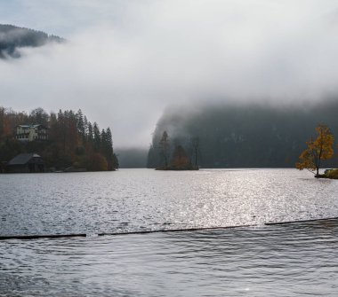 Mountain alpine autumn misty morning lake Konigssee, Schonau am 
