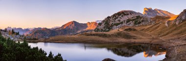 Early morning autumn alpine Dolomites mountain scene. Peaceful V