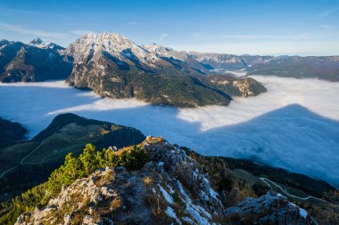Autumn Alps mountain misty morning view from Jenner Viewing Platform, Schonau am Konigssee, Berchtesgaden national park, Bavaria, Germany. Picturesque traveling, seasonal and nature beauty scene.