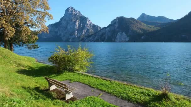 Peaceful Autumn Alps Mountain Lake Wooden Bench Park Morning View — Stock Video