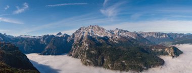 Autumn Alps mountain misty morning view from Jenner Viewing Platform, Schonau am Konigssee, Berchtesgaden national park, Bavaria, Germany.  Picturesque traveling, seasonal and nature beauty scene.