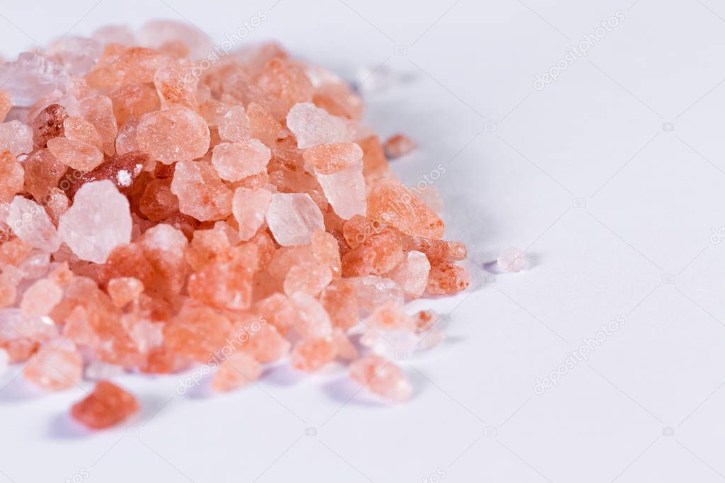 Himalayan pink salt on white