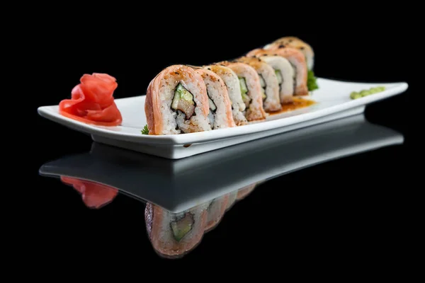 Sushi roll on black — Stock Photo, Image