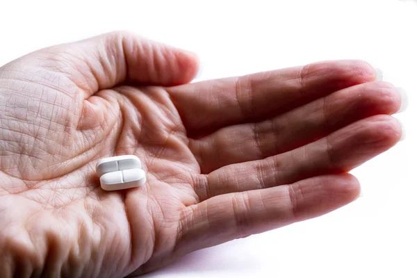 Pain killers in a hand — Stock Photo, Image