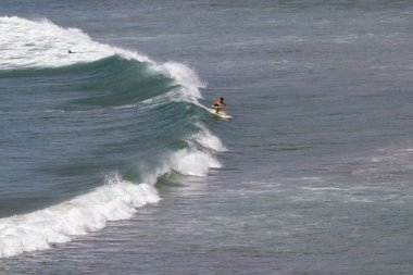 Surfing in popoyo clipart