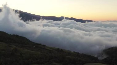 Early morning fog clinging to the mountain range in the rural south of Costa Rica