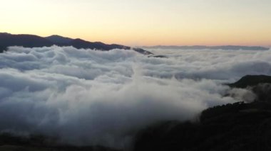 Early morning fog clinging to the mountain range in the rural south of Costa Rica