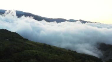 Early morning fog clinging to the mountain range in the rural south of Costa Rica