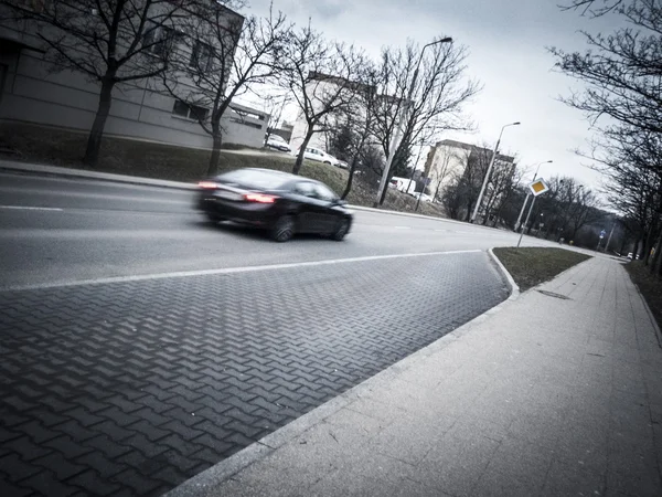 Car passing on Gdansk road on overcast day — Stock Photo, Image
