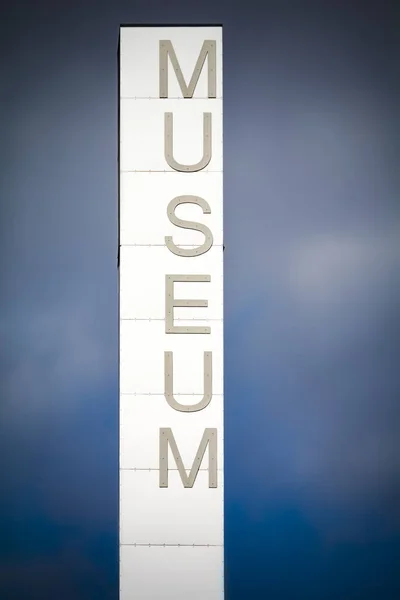 Tall museum sign outside cultural centre in Scandinavia — Stock Photo, Image