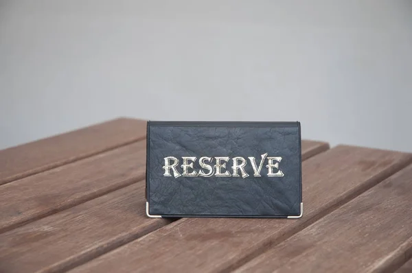 Reserved sign on the table .
