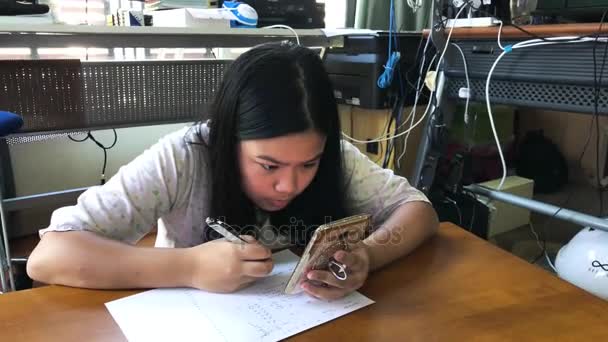 Girl doing homework — Stock Video