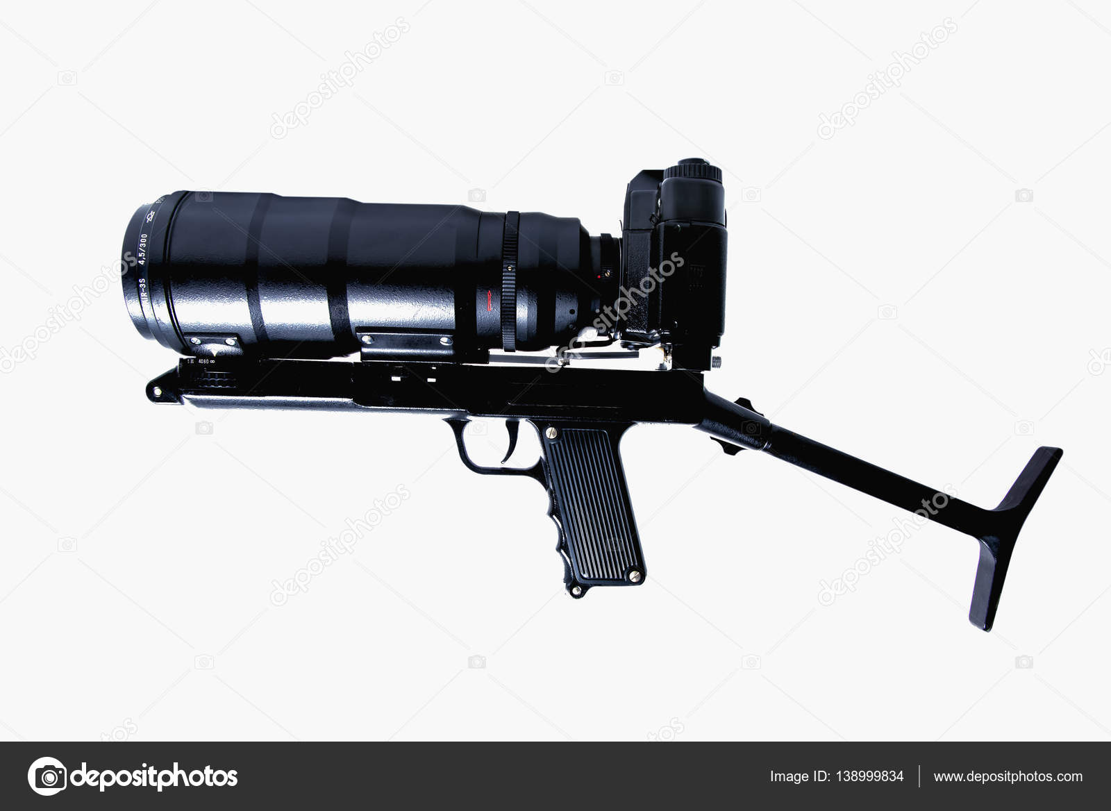 The camera is actually held in the same manner as a rifle — Stock Photo