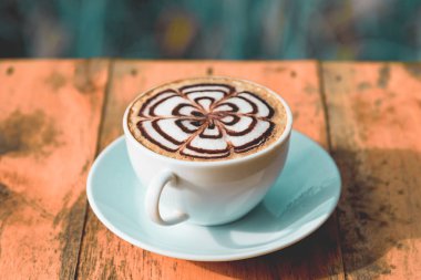 Tablo içinde alan manzaralı kafe salonu kahve fincanı