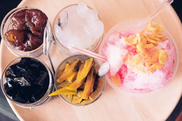 Shaved ice. Frozen Fruit Slush Drinks,Shaved Ice dessert on wood plate, Mix dessert