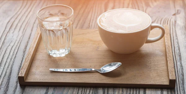 Coffee cup on wooden table — Stock Photo, Image