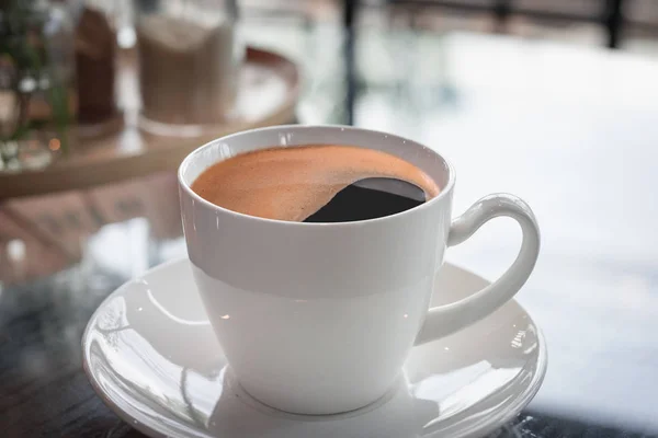 Coffee cup on wooden table — Stock Photo, Image