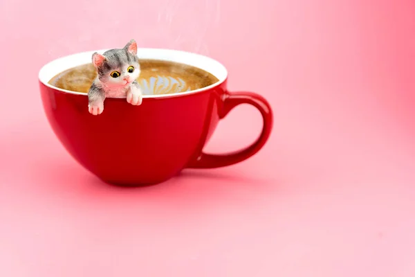 A cat model in a red coffee mug