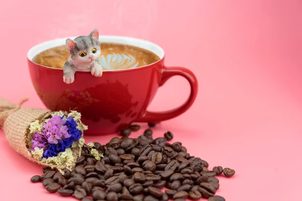 A cat model in a red coffee mug